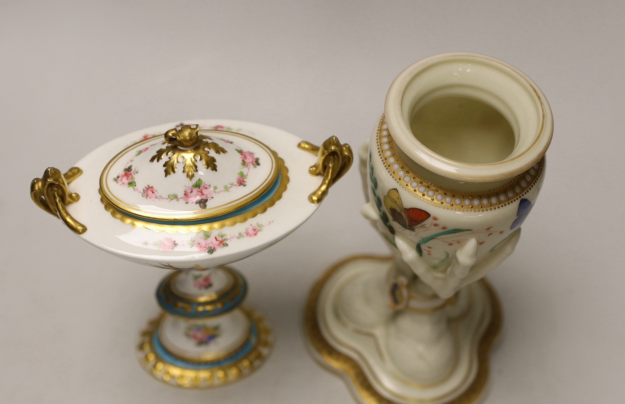 A Royal Worcester urn, modelled as three birds legs holding an oviform vase and a Royal Crown Derby two handled urn and cover on stand, Worcester urn 17cms high